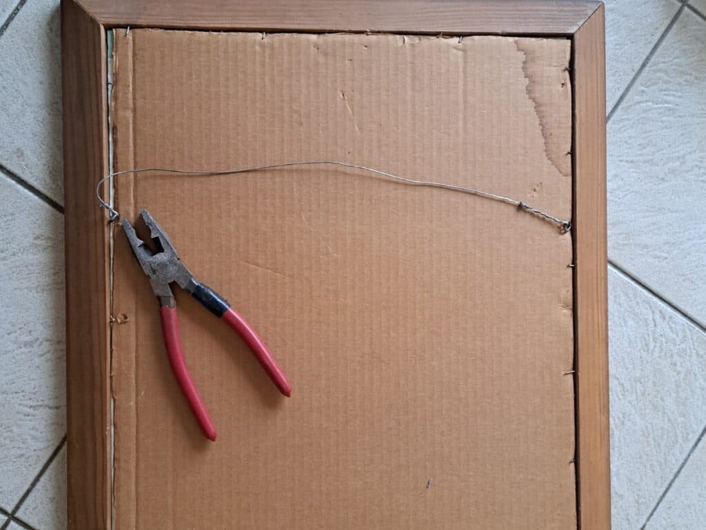 Remover fasteners from the back of the frame with red handled plyers.