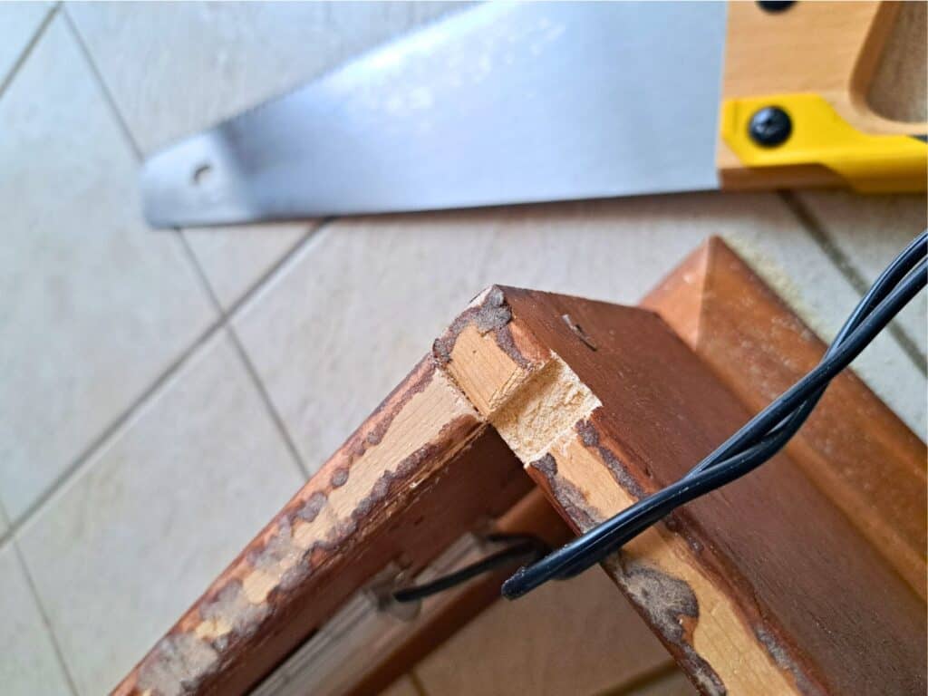 Creating a notch in the back of the frame so wires can pass through.