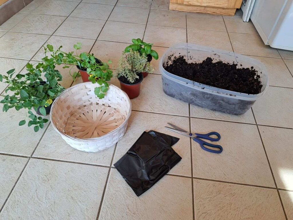 Supplies gathered on the kitchen floor to make a kitchen herb basket.