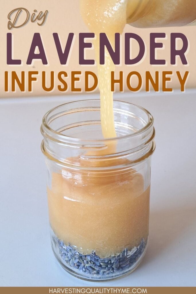 Honey being poured over top of dried lavender buds in a clear glass jar.